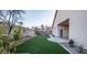 Artificial turf backyard with a patio and block wall at 1240 Honey Lake St, Las Vegas, NV 89110