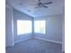 Bright bedroom with two windows and ceiling fan at 1628 Rio Bravo Dr, North Las Vegas, NV 89031