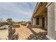 Landscaped backyard with patio and built-in grill at 1779 Sebring Hills Dr, Henderson, NV 89052