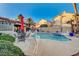 Inviting kidney-shaped pool with patio furniture at 2686 African Violet Ave, Henderson, NV 89074