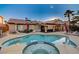 Inviting kidney-shaped pool with spa and ample lounge space at 2686 African Violet Ave, Henderson, NV 89074