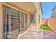 A patio with a sliding glass door leads to a small patch of artificial turf at 2694 Marvel Astoria St, Henderson, NV 89044