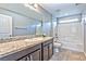 Bathroom featuring granite countertops, under-sink cabinets, and a shower/tub combo at 2694 Marvel Astoria St, Henderson, NV 89044
