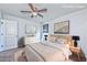 This bedroom features neutral decor, a ceiling fan, carpet and lots of natural light at 2694 Marvel Astoria St, Henderson, NV 89044