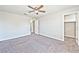 Bedroom with carpeted floors, ceiling fan, and closet entryway at 2694 Marvel Astoria St, Henderson, NV 89044