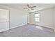 Bedroom with carpeted floors, ceiling fan and natural lighting at 2694 Marvel Astoria St, Henderson, NV 89044