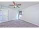 Bedroom with carpeted floors, ceiling fan and natural lighting at 2694 Marvel Astoria St, Henderson, NV 89044