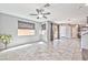 Expansive living room with tile flooring, neutral walls, and abundant natural light from large windows at 2694 Marvel Astoria St, Henderson, NV 89044