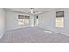 Large main bedroom with plush carpets, a ceiling fan, and natural lighting at 2694 Marvel Astoria St, Henderson, NV 89044