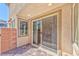 Covered patio with brick pavers and sliding glass door at 2694 Marvel Astoria St, Henderson, NV 89044