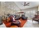 Relaxing living room with leather armchairs and wood accents at 2847 San Martin Ct, Las Vegas, NV 89121