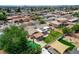 An aerial view showing a swimming pool, green lawns, and house at 4440 E Boston Ave, Las Vegas, NV 89104
