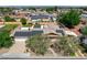 An aerial view highlighting the home's solar panels, driveway, and surrounding neighborhood at 4440 E Boston Ave, Las Vegas, NV 89104