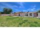Spacious backyard with lush lawn, patio area, and rear exterior view of the home at 4440 E Boston Ave, Las Vegas, NV 89104
