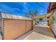 Exterior shed with metal roof and backyard with view of block wall at 4440 E Boston Ave, Las Vegas, NV 89104