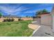 Large backyard featuring grass, a patio area, and a block wall for privacy at 4440 E Boston Ave, Las Vegas, NV 89104