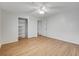 Bedroom with laminate floors, ceiling fan, and closet at 4440 E Boston Ave, Las Vegas, NV 89104
