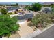 Charming single-Gathering home featuring a well-maintained front yard, solar panels, and a two-car garage at 4440 E Boston Ave, Las Vegas, NV 89104