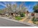 Inviting front of house with mature landscaping, covered entry and secure fenced yard at 4440 E Boston Ave, Las Vegas, NV 89104