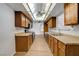 Spacious kitchen with wood cabinets, countertops, and stainless steel appliances at 4440 E Boston Ave, Las Vegas, NV 89104
