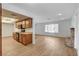A bright kitchen adjacent to the living room, featuring modern appliances and laminate flooring at 4440 E Boston Ave, Las Vegas, NV 89104