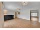 Living room area with a bar, updated flooring, and lots of natural light at 4440 E Boston Ave, Las Vegas, NV 89104