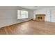 Bright living room featuring wood-look floors, fireplace, and neutral paint at 4440 E Boston Ave, Las Vegas, NV 89104