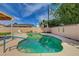 Backyard pool needing some TLC with surrounding patio and partial view of the home at 4440 E Boston Ave, Las Vegas, NV 89104