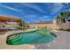 Backyard pool needing some TLC with surrounding patio and partial view of the home at 4440 E Boston Ave, Las Vegas, NV 89104