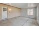 Sunroom with access door, window, neutral paint, and concrete floors at 4440 E Boston Ave, Las Vegas, NV 89104