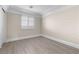 Bright bedroom with wood-look floors and plantation shutters at 4820 Morning Splash Ave, Las Vegas, NV 89131