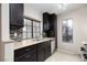 Kitchen features dark wood cabinets, granite countertops, and tile backsplash at 4839 S Torrey Pines Dr # 102, Las Vegas, NV 89103