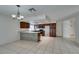 Updated kitchen with wood cabinets and breakfast bar at 5841 Auckland Dr, Las Vegas, NV 89110