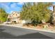 Two-story house with attached garage and landscaping at 5962 Bassio Ave, Las Vegas, NV 89141