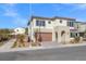 Two-story house with attached garage and desert landscaping at 6833 Desert Finch St, North Las Vegas, NV 89084