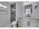 Modern bathroom with gray and white tile and vanity at 7437 Lattimore Dr, Las Vegas, NV 89128