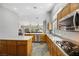 Spacious kitchen with stainless steel appliances and an island at 7511 Bridlehorne Ave, Las Vegas, NV 89131