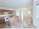 Spacious kitchen with island, wood cabinets, and tile floor at 7637 Constellation St, Las Vegas, NV 89123