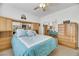 Bedroom with teal bedding and built-in mirrored headboard at 8830 Rancho Destino Rd, Las Vegas, NV 89123