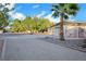 Spacious driveway leading to a large three-car garage at 8830 Rancho Destino Rd, Las Vegas, NV 89123