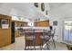 Spacious kitchen with wood cabinets, stainless steel appliances, and a breakfast bar at 8830 Rancho Destino Rd, Las Vegas, NV 89123