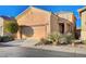 Two-story house with attached garage and desert landscaping at 8856 Ashley Park Ave, Las Vegas, NV 89148