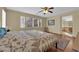 Serene bedroom with hardwood floors, ceiling fan, and ensuite bathroom access at 9161 Horizon Mist Ave, Las Vegas, NV 89178