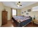 Spacious bedroom with wood floors and a ceiling fan at 9161 Horizon Mist Ave, Las Vegas, NV 89178