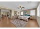 Comfortable bedroom with hardwood floors, ceiling fan, and access to other rooms at 9161 Horizon Mist Ave, Las Vegas, NV 89178