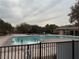 Inviting community pool with a surrounding fence at 9161 Horizon Mist Ave, Las Vegas, NV 89178