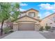 Two-story house with a brown garage door and stone accents at 9161 Horizon Mist Ave, Las Vegas, NV 89178