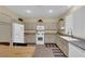Well-equipped kitchen with white appliances and granite counters at 9161 Horizon Mist Ave, Las Vegas, NV 89178