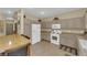 Modern kitchen with white appliances and light-grey cabinetry at 9161 Horizon Mist Ave, Las Vegas, NV 89178