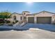 Single-story home with a two-car garage and attractive curb appeal at 9303 Oxbow Lake Ave, Las Vegas, NV 89149